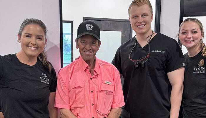 Cosmetic-Dentistry patient with doctor and staff