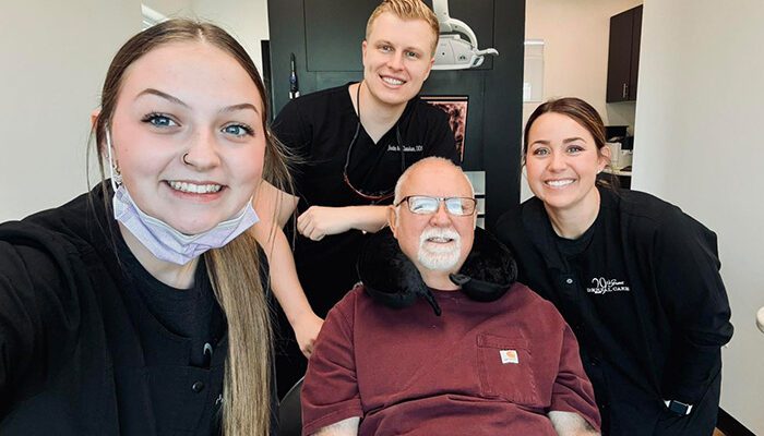 dental-technology staff with the patient