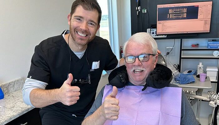oral-surgery Doctor with patient holding thumbs up